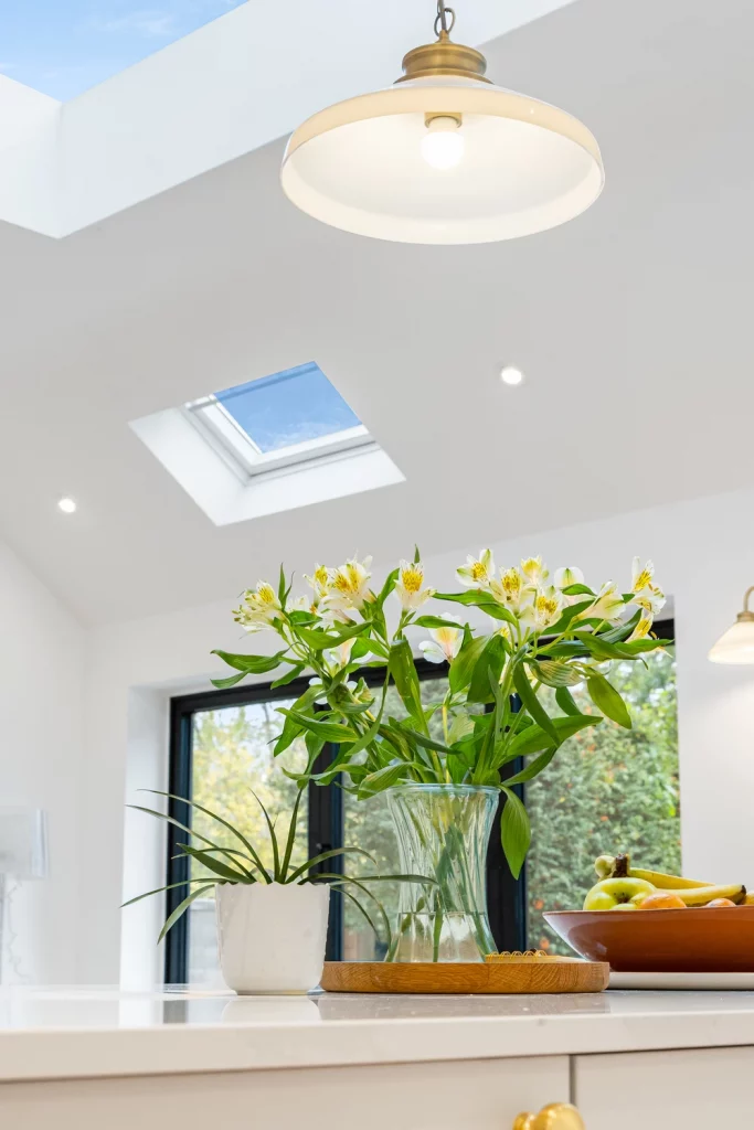 Large ceiling glass allowing ample amounts of natural light into the kitchen